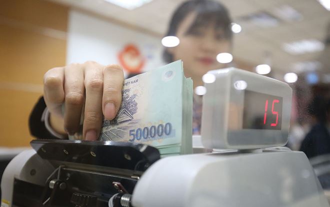 Ngân hàng đẩy mạnh phòng thủ nợ xấu - Ảnh 1. Ngân hàng đẩy mạnh phòng thủ nợ xấu - Ảnh 1.