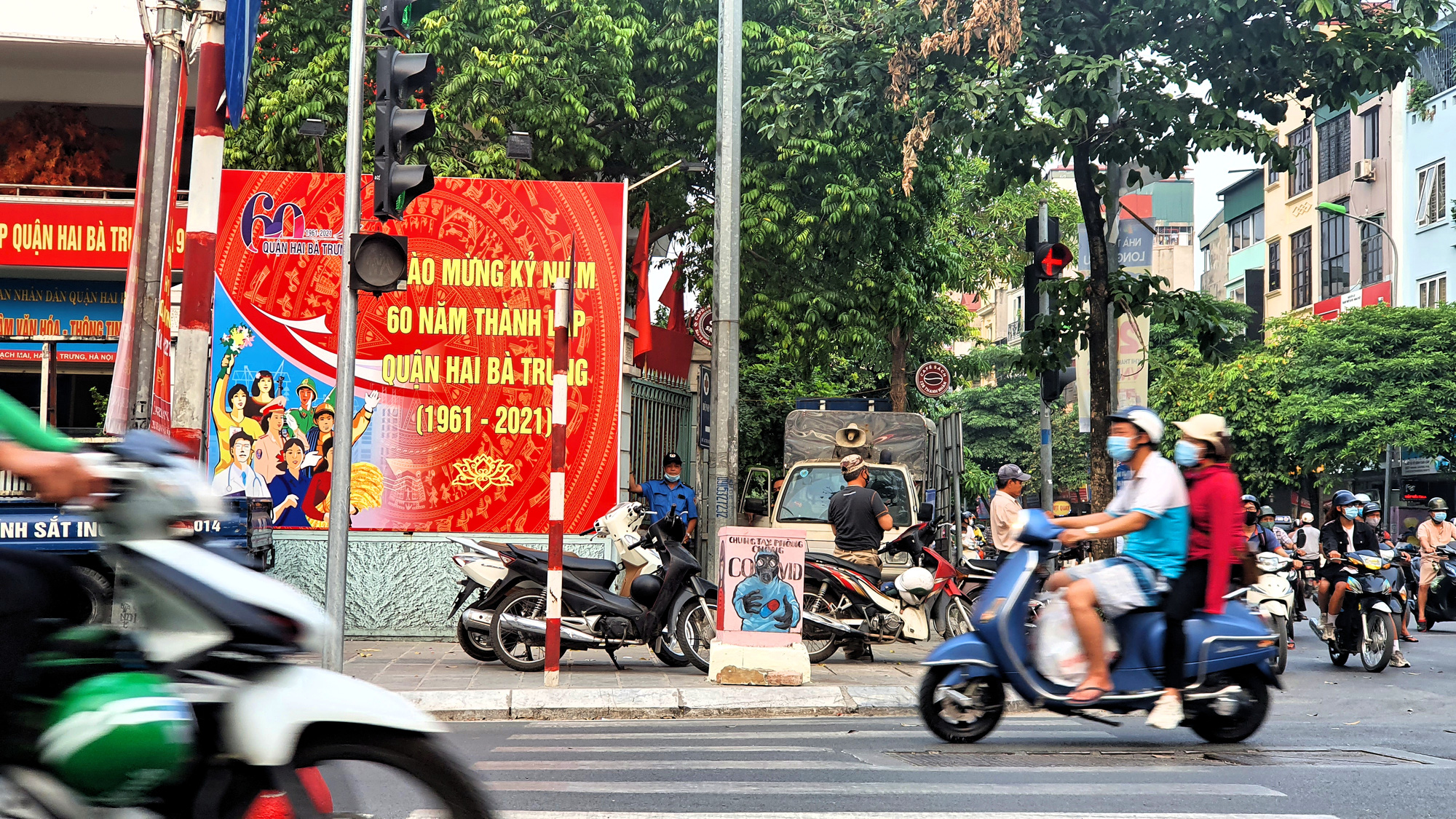 Chấm dứt giãn cách xã hội theo từng cấp độ dịch - Ảnh 1. Chấm dứt giãn cách xã hội theo từng cấp độ dịch - Ảnh 1.