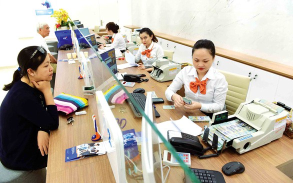 Cuộc chiến phí ngân hàng 0 đồng - Ảnh 1. Cuộc chiến phí ngân hàng 0 đồng - Ảnh 1.