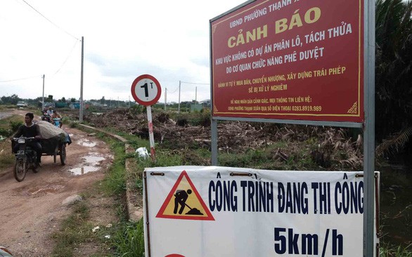 Bãi rác, nghĩa trang bị phân lô bán nền 'ma', tại sao cơ quan chức năng chỉ... cảnh báo? - Ảnh 2.