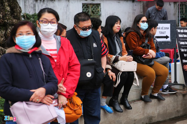 Tràn ngập cảnh đeo khẩu trang du xuân từ Bắc vào Nam - Ảnh 4.