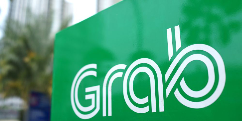 Grab hủy chương trình ứng tiền mặt với tài xế và đối tác giao đồ ăn - Ảnh 1.