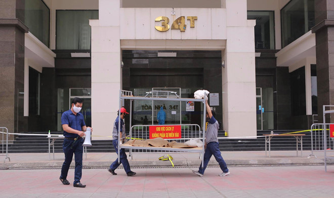 Hà Nội phong tỏa toà 34T Trung Hoà Nhân Chính vì có người dương tính SARS-Cov-2 - Ảnh 3. Hà Nội phong tỏa toà 34T Trung Hoà Nhân Chính vì có người dương tính SARS-Cov-2 - Ảnh 3.