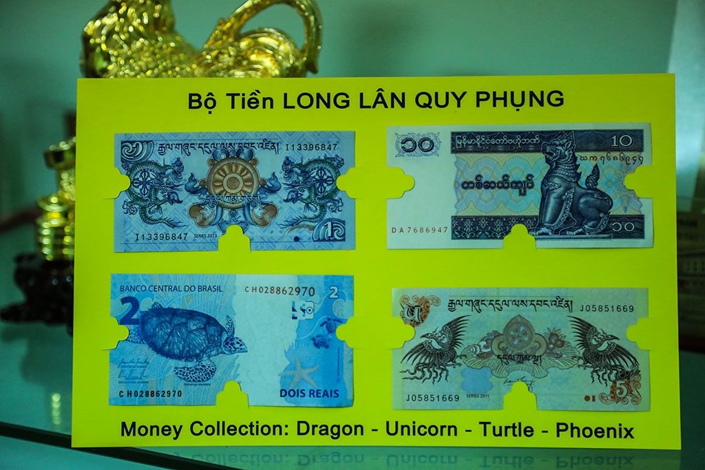 san tien ngoai te in hinh con ga vao dip tet dinh dau