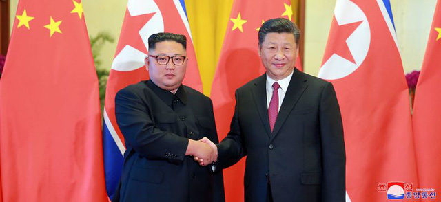 trieu tien bat ngo cong bo hinh anh ong kim jong un tham trung quoc