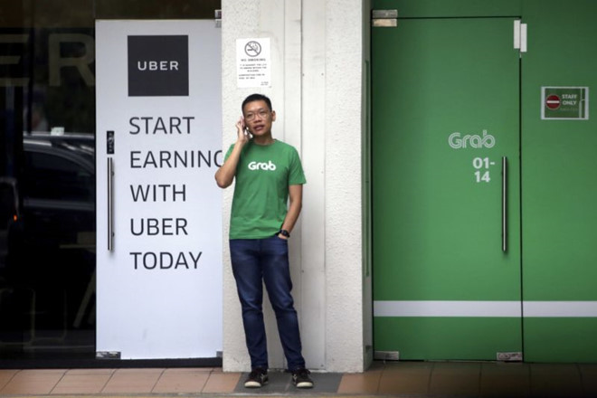 thuong vu grab mua uber co kha nang bi singapore huy bo
