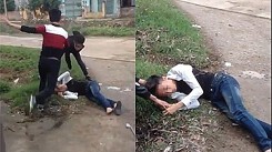 Thanh niên cầm dao bị nhóm cầm tuýp sắt đánh gục ở cổng trường