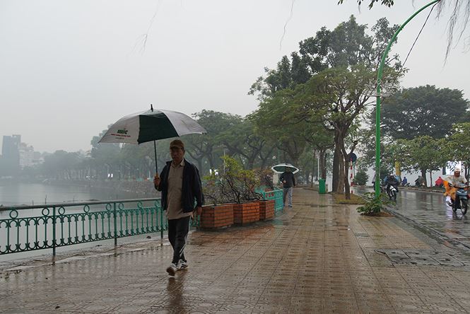 nguoi ha noi vat va trong ngay mit mu mua ret tang cuong
